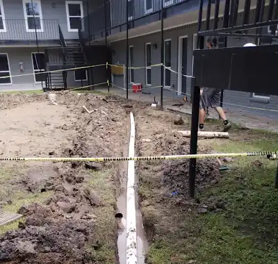 Exterior site work in progress at an apartment renovation