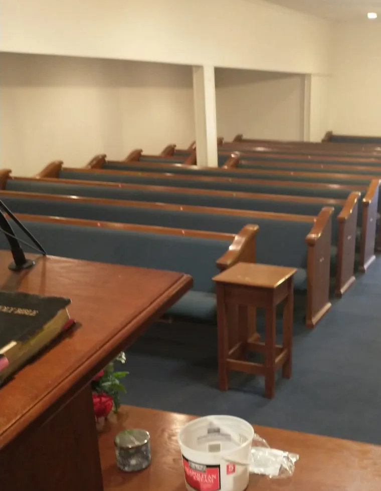 Sanctuary finish work near completion during a church interior renovation