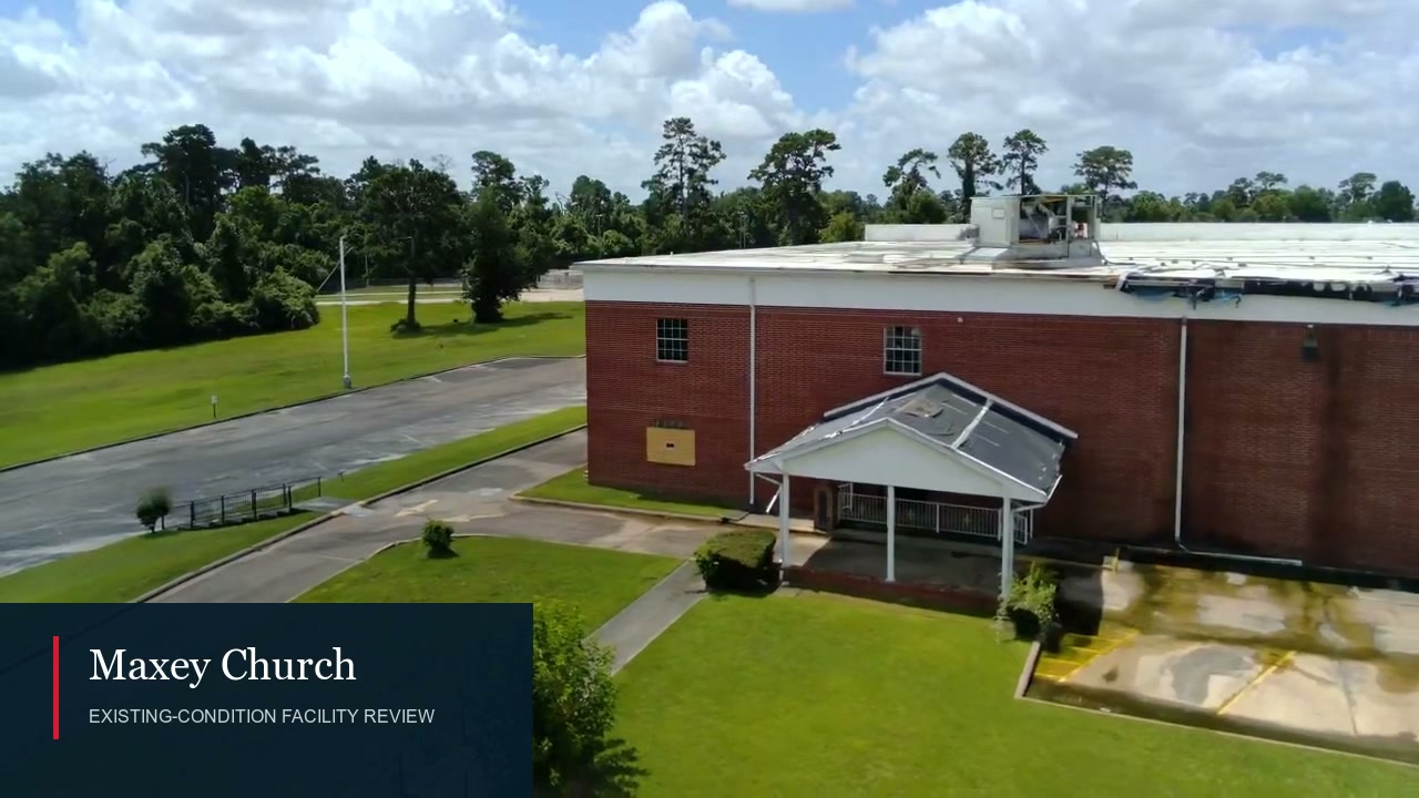 Silent aerial and interior footage showing roof and interior conditions at the Maxey church project